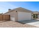 Well-kept garage with a large white door and low-maintenance landscaping at 2227 W Cambridge Ave, Phoenix, AZ 85009