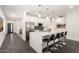 Modern kitchen with a large island and bar seating, featuring stainless steel appliances at 2227 W Cambridge Ave, Phoenix, AZ 85009