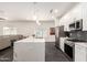 Bright kitchen with stainless steel appliances, a large island, and modern finishes at 2227 W Cambridge Ave, Phoenix, AZ 85009