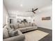 Open-concept living space featuring a cozy sectional couch and a view of the modern kitchen at 2227 W Cambridge Ave, Phoenix, AZ 85009