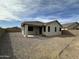 Backyard with an awning, desert landscaping, and fencing at 2344 E Alida Trl, Casa Grande, AZ 85194