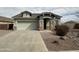 Inviting single-story home with a two car garage and desert landscaping at 2344 E Alida Trl, Casa Grande, AZ 85194