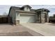 Charming single-story home with a two car garage and stone veneer accents at 2344 E Alida Trl, Casa Grande, AZ 85194