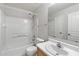 Bathroom featuring a shower-tub combo and single sink vanity at 24118 W Desert Bloom St, Buckeye, AZ 85326