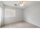 Bedroom features tile flooring, window and a ceiling fan at 24118 W Desert Bloom St, Buckeye, AZ 85326