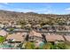 Aerial view of a backyard with a pool, and desert landscaping in a beautiful neighborhood at 2419 E Goldenrod St, Phoenix, AZ 85048