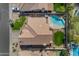 Aerial view of home featuring a swimming pool, outdoor furniture, and well-maintained desert landscaping at 2419 E Goldenrod St, Phoenix, AZ 85048