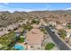 Aerial view of a beautiful neighborhood featuring mature trees, desert landscaping and mountain views at 2419 E Goldenrod St, Phoenix, AZ 85048