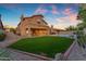 Spacious backyard featuring a well-maintained lawn, a pool, and an outdoor patio at 2419 E Goldenrod St, Phoenix, AZ 85048