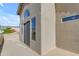 This balcony has neutral stucco walls and a large sliding glass door that lets in natural light at 2419 E Goldenrod St, Phoenix, AZ 85048