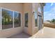 The balcony has exterior stucco walls and a large sliding glass door that lets in natural light at 2419 E Goldenrod St, Phoenix, AZ 85048