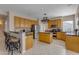 Spacious kitchen featuring a large island, stainless steel appliances, and plentiful cabinet space at 2419 E Goldenrod St, Phoenix, AZ 85048