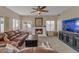 Bright living room with a fireplace, TV and comfortable seating for a relaxed atmosphere at 2419 E Goldenrod St, Phoenix, AZ 85048