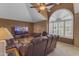 Bright and airy living room with a high ceiling, a large window, and comfortable seating at 2419 E Goldenrod St, Phoenix, AZ 85048