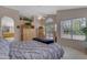 Bright main bedroom with sliding glass doors and a neutral color palette at 2419 E Goldenrod St, Phoenix, AZ 85048