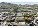 Aerial view of homes featuring backyard pools, green lawns, and desert landscaping at 2525 E Nisbet Rd, Phoenix, AZ 85032