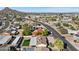 Expansive aerial view of a neighborhood with lush greenery and a scenic mountain backdrop at 2525 E Nisbet Rd, Phoenix, AZ 85032