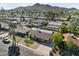 Aerial shot of a lovely home in a neighborhood setting with mature trees and a mountain view at 2525 E Nisbet Rd, Phoenix, AZ 85032