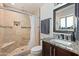 Bathroom featuring tile shower, granite vanity, and modern fixtures at 2525 E Nisbet Rd, Phoenix, AZ 85032