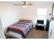 Bedroom with contemporary furnishings, neutral paint, large window, and carpeted floor at 27 N 199Th Ave, Buckeye, AZ 85326