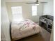 Bedroom boasts natural light, a ceiling fan, and versatile built-in bunk bed frame at 27 N 199Th Ave, Buckeye, AZ 85326