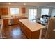 Spacious kitchen with a center island, dining table, and stainless steel appliances at 27 N 199Th Ave, Buckeye, AZ 85326