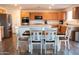 Modern kitchen featuring stainless steel appliances, light countertops, and ample cabinet space at 27 N 199Th Ave, Buckeye, AZ 85326