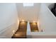 Bright staircase with carpeted steps leading to the upper level of the home at 27 N 199Th Ave, Buckeye, AZ 85326