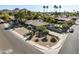 Expansive aerial shot showcases desert landscaping, a private pool, and ample parking at 301 E Carol Ann Way, Phoenix, AZ 85022