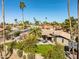 Picturesque aerial image of a private pool, patio area, green lawn, and mature landscaping at 301 E Carol Ann Way, Phoenix, AZ 85022