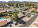 Beautiful aerial view of the house and its mature landscaping, private pool, and the surrounding neighborhood at 301 E Carol Ann Way, Phoenix, AZ 85022