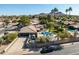 Sweeping aerial perspective highlighting desert landscape and a private backyard pool with mountain views at 301 E Carol Ann Way, Phoenix, AZ 85022