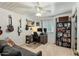 A cozy bedroom featuring guitars mounted on the wall and a functional workspace at 301 E Carol Ann Way, Phoenix, AZ 85022