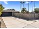 Long driveway leading to a spacious two-car garage, providing ample parking at 301 E Carol Ann Way, Phoenix, AZ 85022