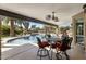 Relaxing covered patio area, perfect for outdoor dining and entertaining by the pool at 301 E Carol Ann Way, Phoenix, AZ 85022