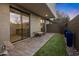 Serene backyard featuring pavers, artificial turf, and access to the home's interior at 3106 N 70Th St # 2003, Scottsdale, AZ 85251