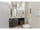 Modern powder room with floating vanity, open storage, and stylish light fixture at 3106 N 70Th St # 2003, Scottsdale, AZ 85251