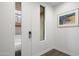 Bright entryway featuring a modern door lock, hardwood floors, and artwork at 3106 N 70Th St # 2003, Scottsdale, AZ 85251