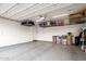 Clean garage featuring epoxy flooring and overhead storage racks for optimal space utilization at 3106 N 70Th St # 2003, Scottsdale, AZ 85251