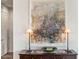 Hallway with sideboard table, abstract art, and decorative lighting at 3106 N 70Th St # 2003, Scottsdale, AZ 85251