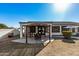 A backyard patio with a pergola provides shade and a charming outdoor space at 3194 E Mead Dr, Chandler, AZ 85249