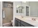 Bright bathroom featuring double sinks, generous counter space, and a step-in shower at 3194 E Mead Dr, Chandler, AZ 85249