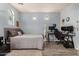 This bedroom features a desk setup, neutral walls, and a comfortable-looking bed at 3194 E Mead Dr, Chandler, AZ 85249