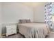 Neutral bedroom featuring soft color palette, comfortable bed, and a matching nightstand at 3194 E Mead Dr, Chandler, AZ 85249