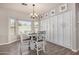 Dining area with built-in white cabinets, a table, and a large bright window at 3194 E Mead Dr, Chandler, AZ 85249