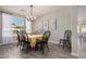 Dining room featuring a black table and chairs set, with art decor and natural light at 3194 E Mead Dr, Chandler, AZ 85249