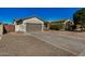 Well-maintained single-story home with a spacious driveway, desert landscaping, and a two-car garage at 3194 E Mead Dr, Chandler, AZ 85249