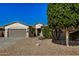 Charming single-story home with desert landscaping, mature trees, and a two-car garage at 3194 E Mead Dr, Chandler, AZ 85249