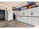 The garage features ample storage space, with cabinets and shelving along the wall at 3194 E Mead Dr, Chandler, AZ 85249