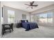 Spacious main bedroom with ample natural light and ceiling fan at 3194 E Mead Dr, Chandler, AZ 85249